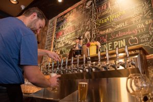 Bartender pouring beer from the tap